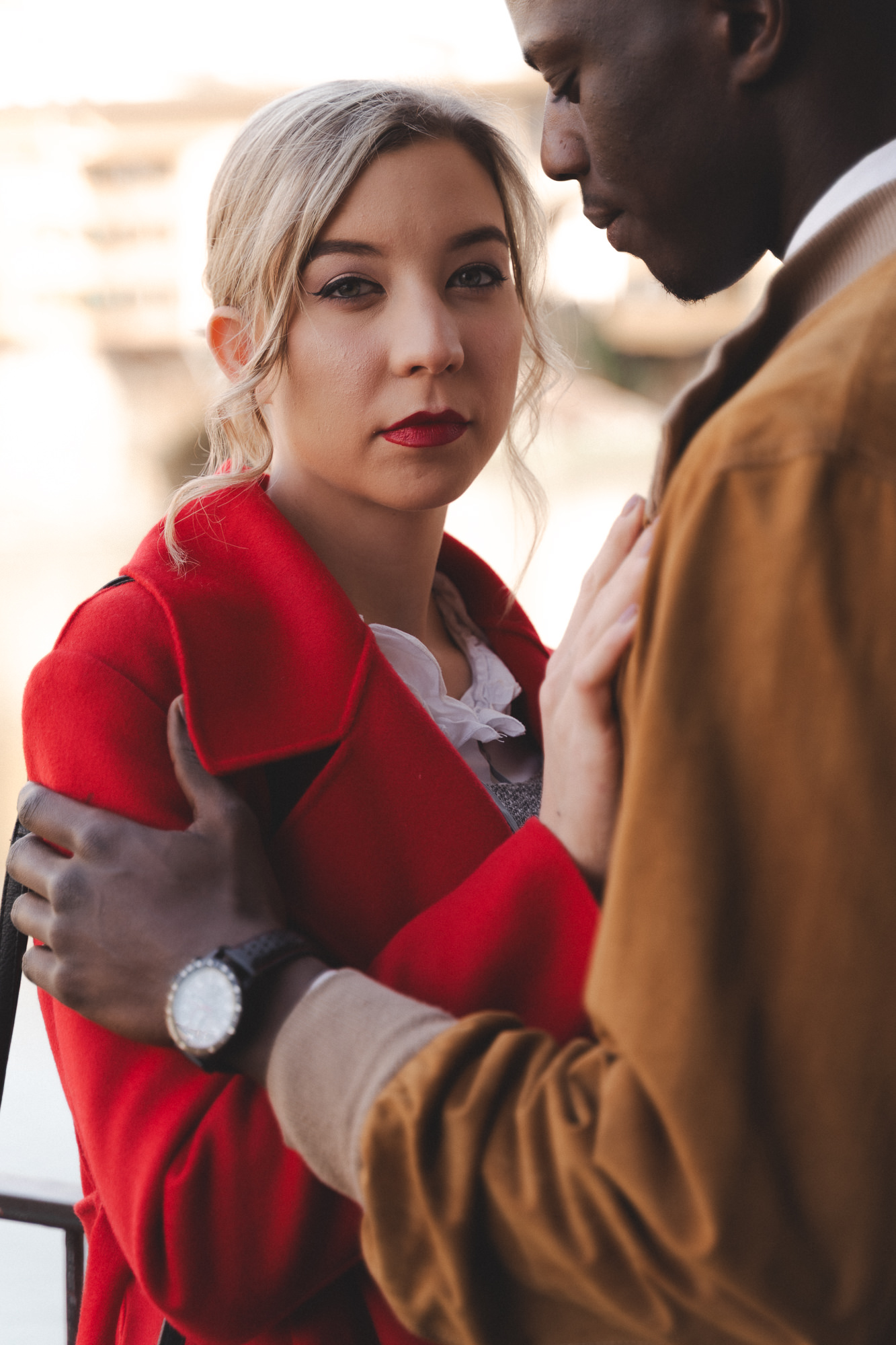 Close-up portrait of a woman in a red coat during an autumn photo shoot in Florence